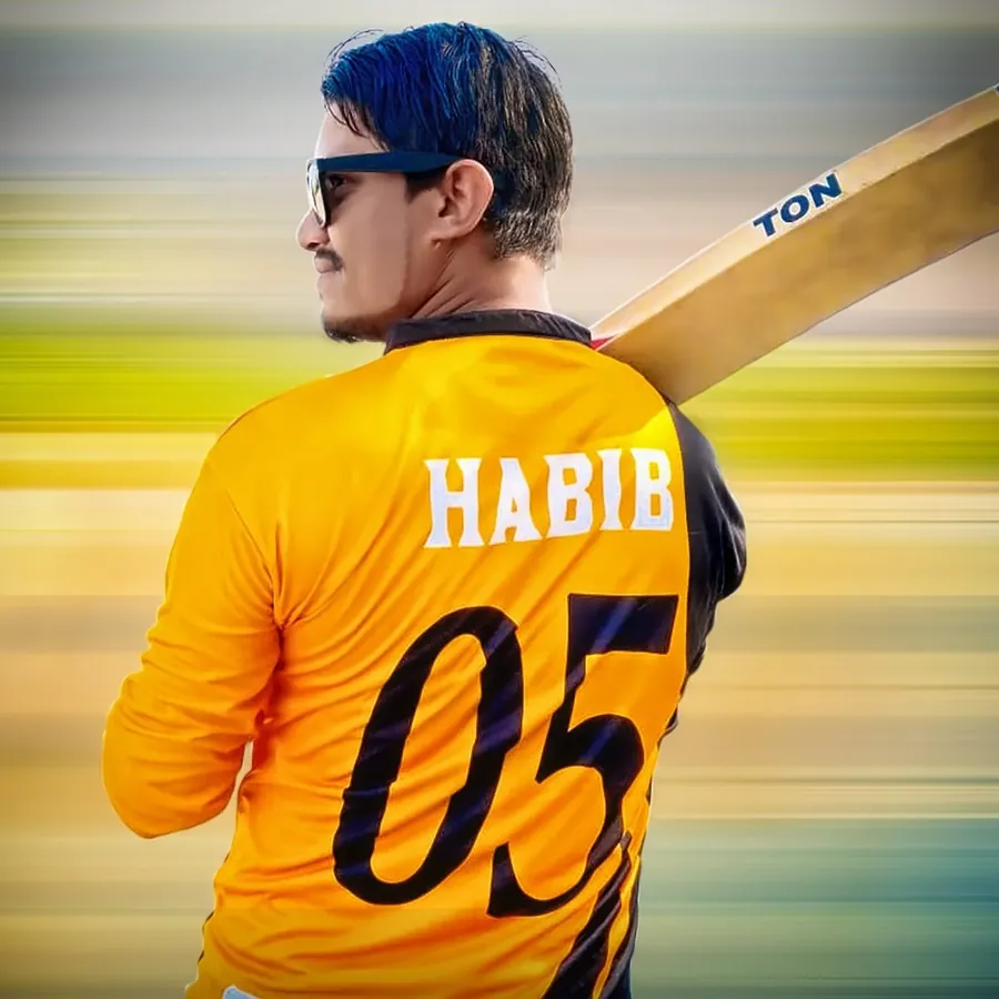 Habib in a yellow number 5 cricket jersey with a bat on his shoulder